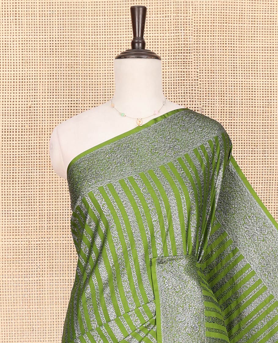 Green Fancy Georgette Saree Adorned with Vertically Zari Stripes, Hazily Zari Woven Border, Hazily Woven Pallu of Intricate Designs, and Paired with a Matching Blouse