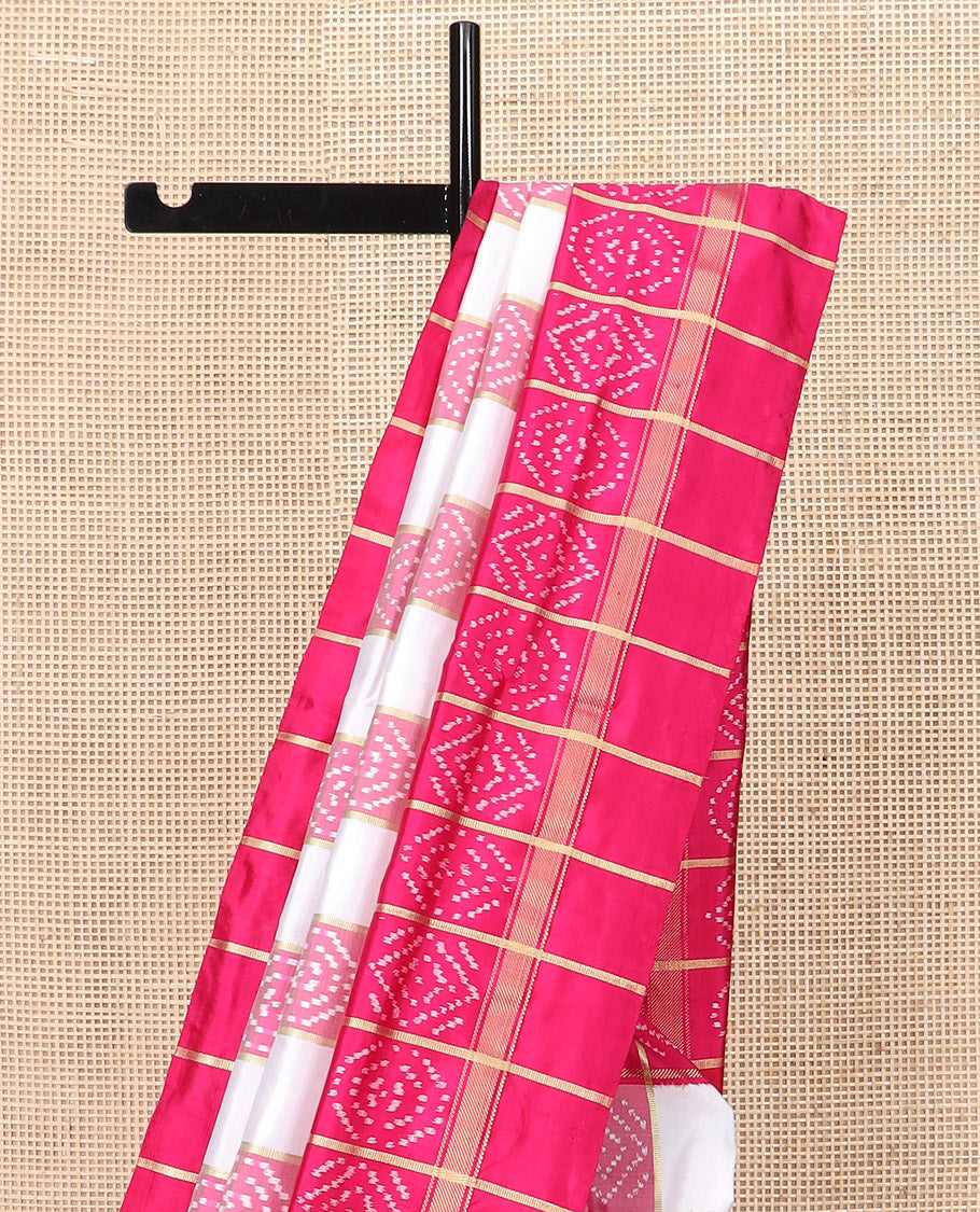 Cream and Pink Ikkat Silk Saree with Ikkat Buttas Enclosed in Checks, Complemented by a Contrast Ikkat Design Border, a Hazily Woven Pallu of Ikkat Patterns, and a Contrast Checked Blouse