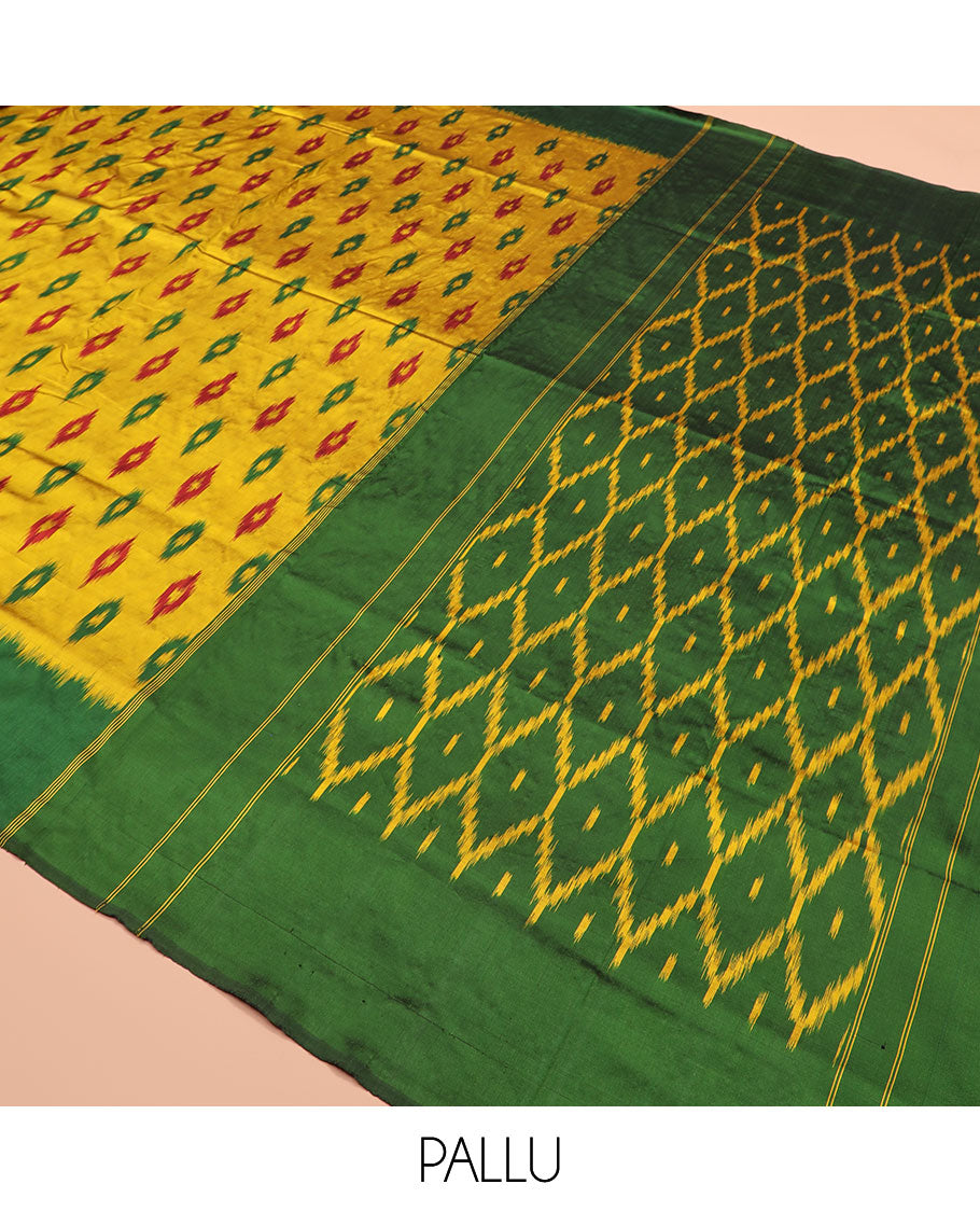 Yellow Ikkat Silk Saree Ornamented with Ikkat Buttas, Featuring a Contrast Plain Border, Complemented by a Pallu Ikkat Woven in an Ogee Pattern