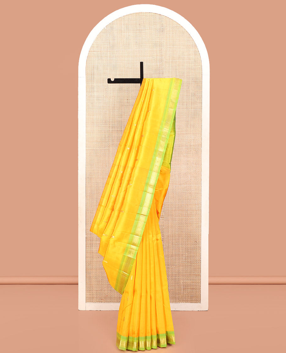 Yellow Kanchipuram Silk Saree, Subtly Sparkled with Zari Buttas, a Contrast One-Sided Border of Banaras, and Mayil Kann Design, Zari-Woven Pallu, and No Blouse