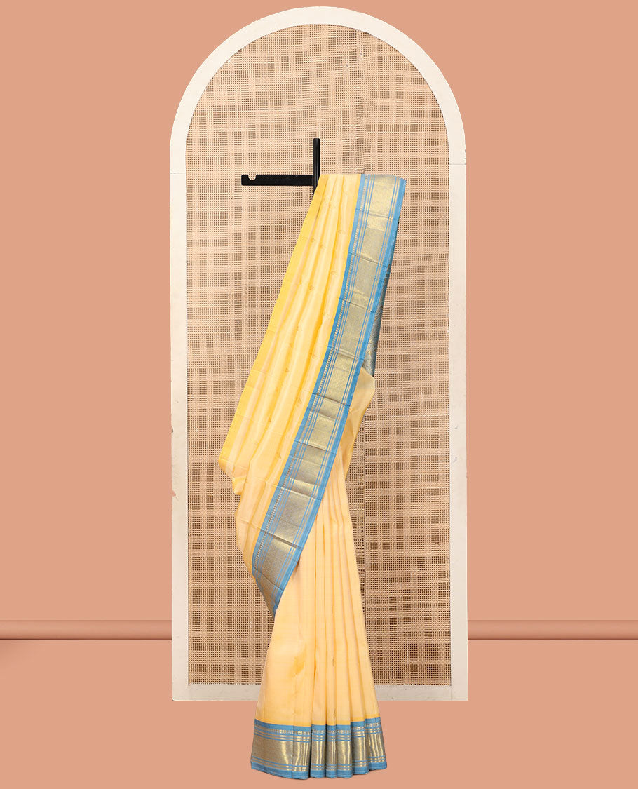 Pale Yellow Kanchipuram Silk Saree, Sparsely Woven with Zari Buttas, a Contrast One-Sided Border of Panner Sombu, Banaras, and Jaal Designs, a Zari Design Pallu, and No Blouse
