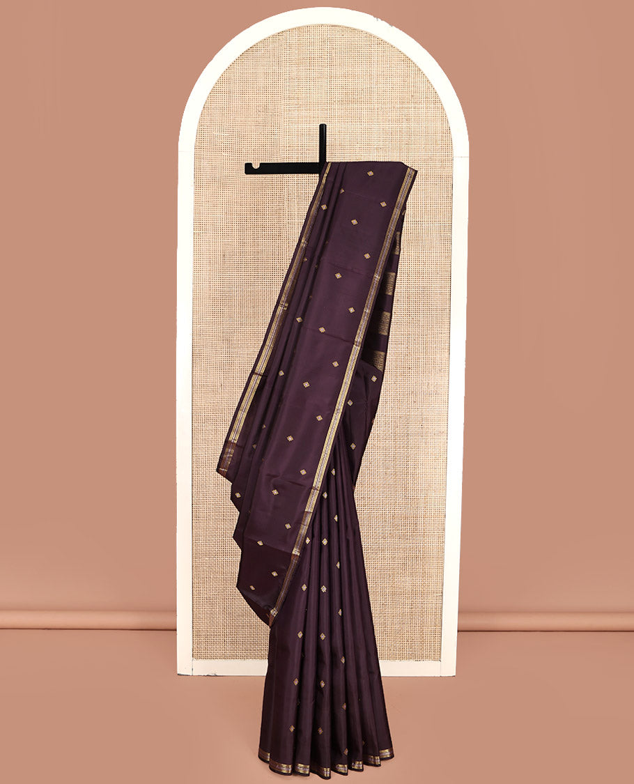 Brown Kanchipuram Silk Saree, Delicately Woven with Zari Buttas All Over Its Body, Highlighted by a Zari Border of Salngai, Muthu, and Rekku Designs, Pallu of Intricate Designs, and Paired with a Matching Blouse