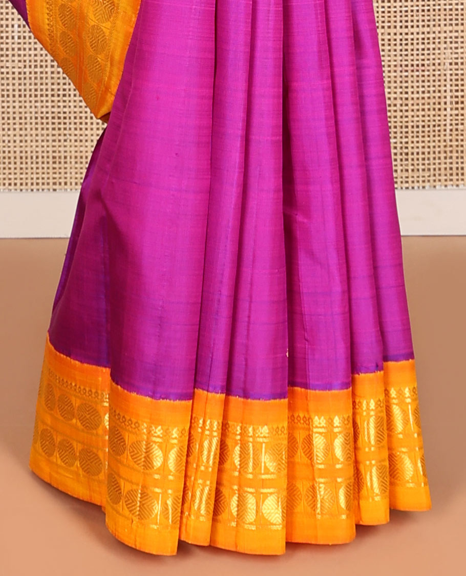 Purple buttas kancheepuram silk saree with contrast korvai border of thilakam mokku, paun design & zari design pallu