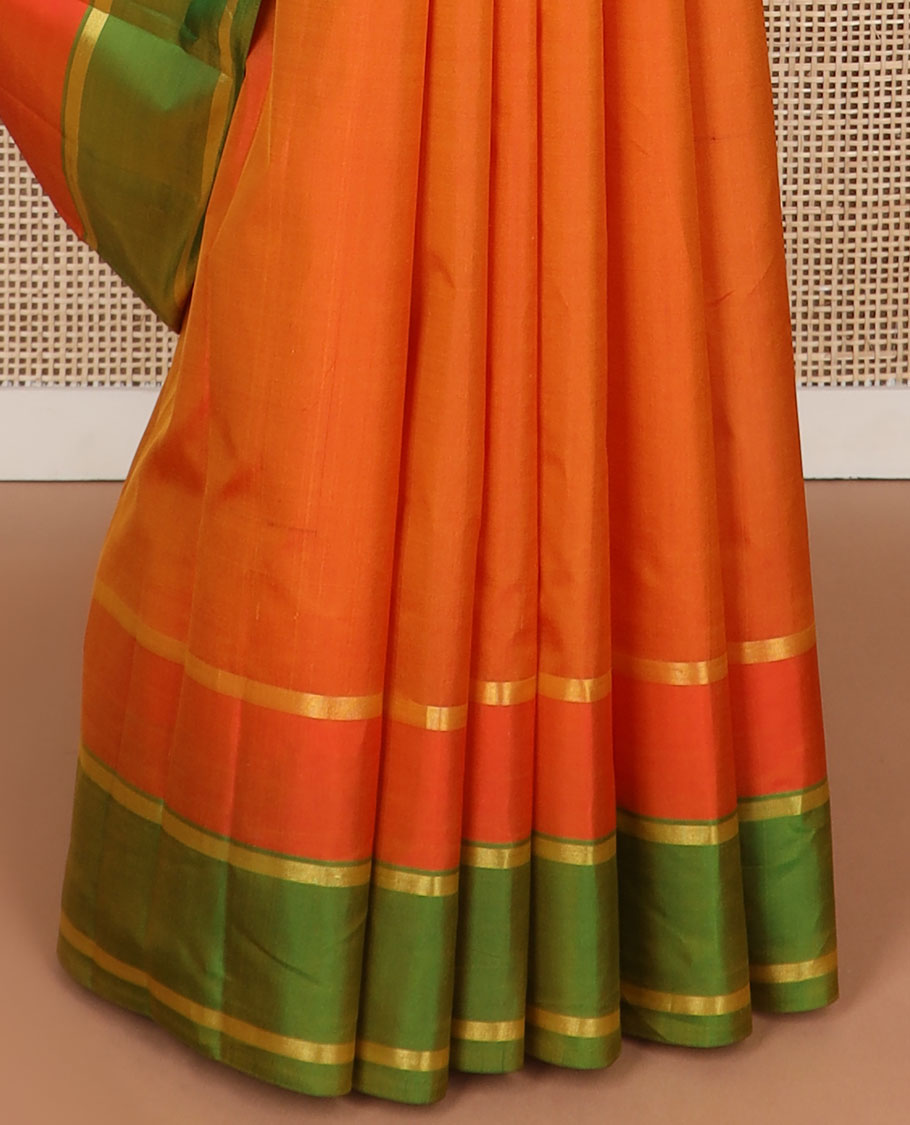 Orange buttas kancheepuram silk saree with contrast zari border & striped, floral motifs pallu