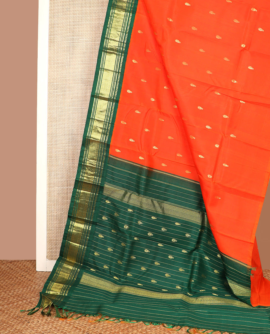 Orange zari buttas Kanchipuram silk saree, contrast one-sided korvai border of paneer sombu, banaras, muthu, and mayil kann, and zari design pallu