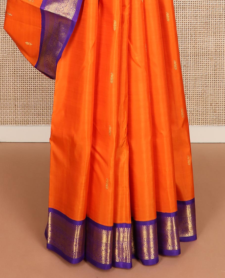 Orange zari buttas Kanchipuram silk saree, contrast korvai border of manga mokku, muthu, zari stripes, and kili motifs, and jaal pallu