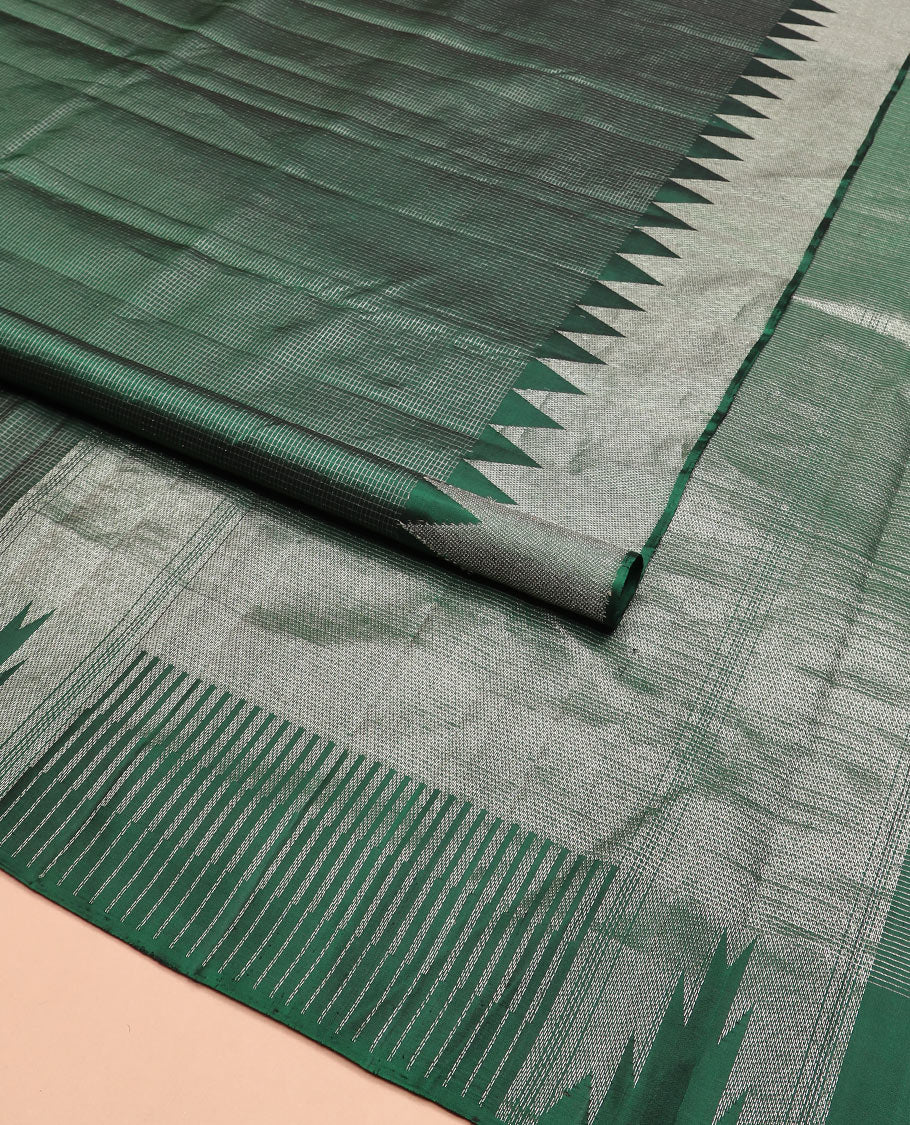Green micro-checked Kanchipuram silk saree, thazampoo rekku zari border, and pallu of seppu rekku designs