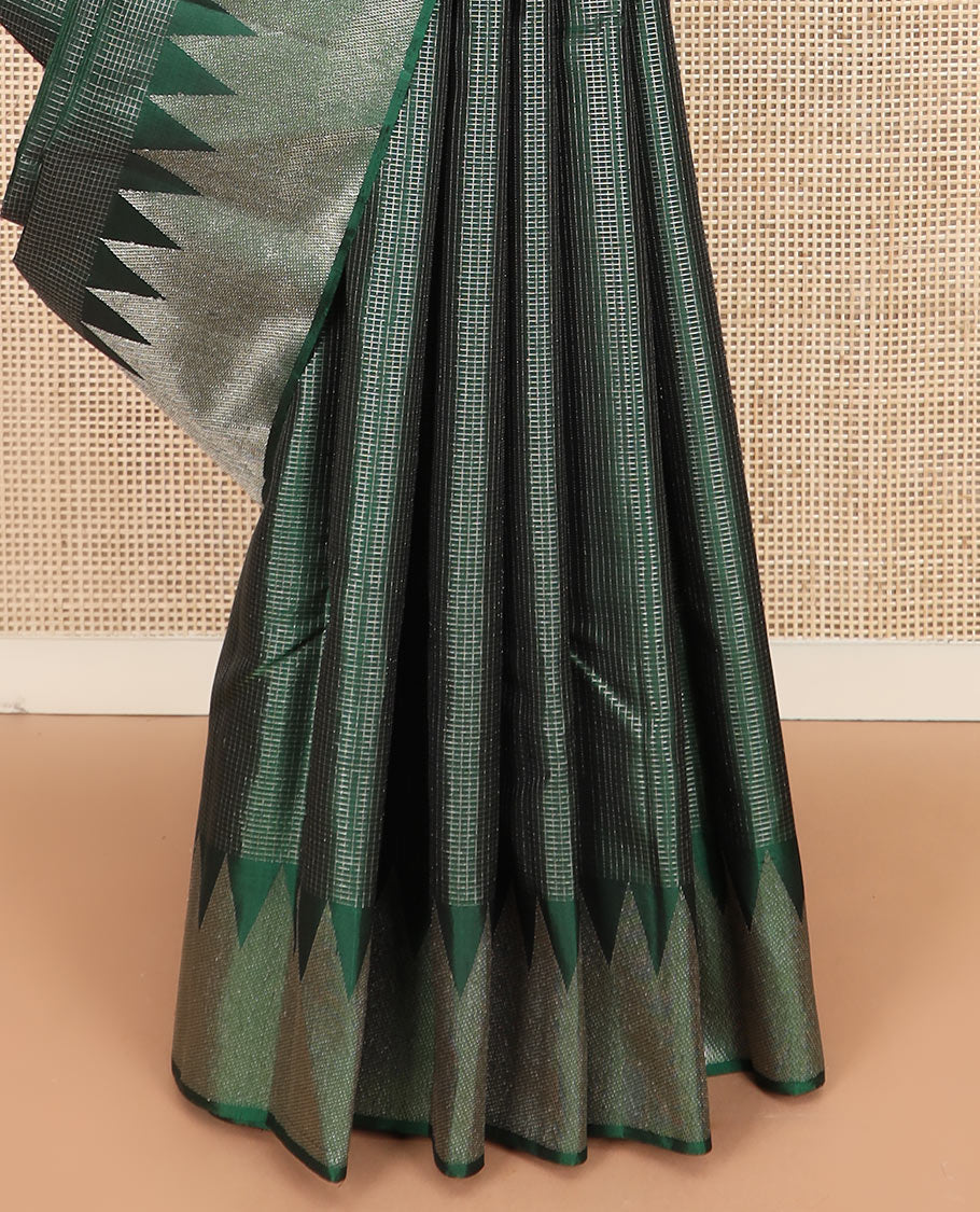 Green micro-checked Kanchipuram silk saree, thazampoo rekku zari border, and pallu of seppu rekku designs