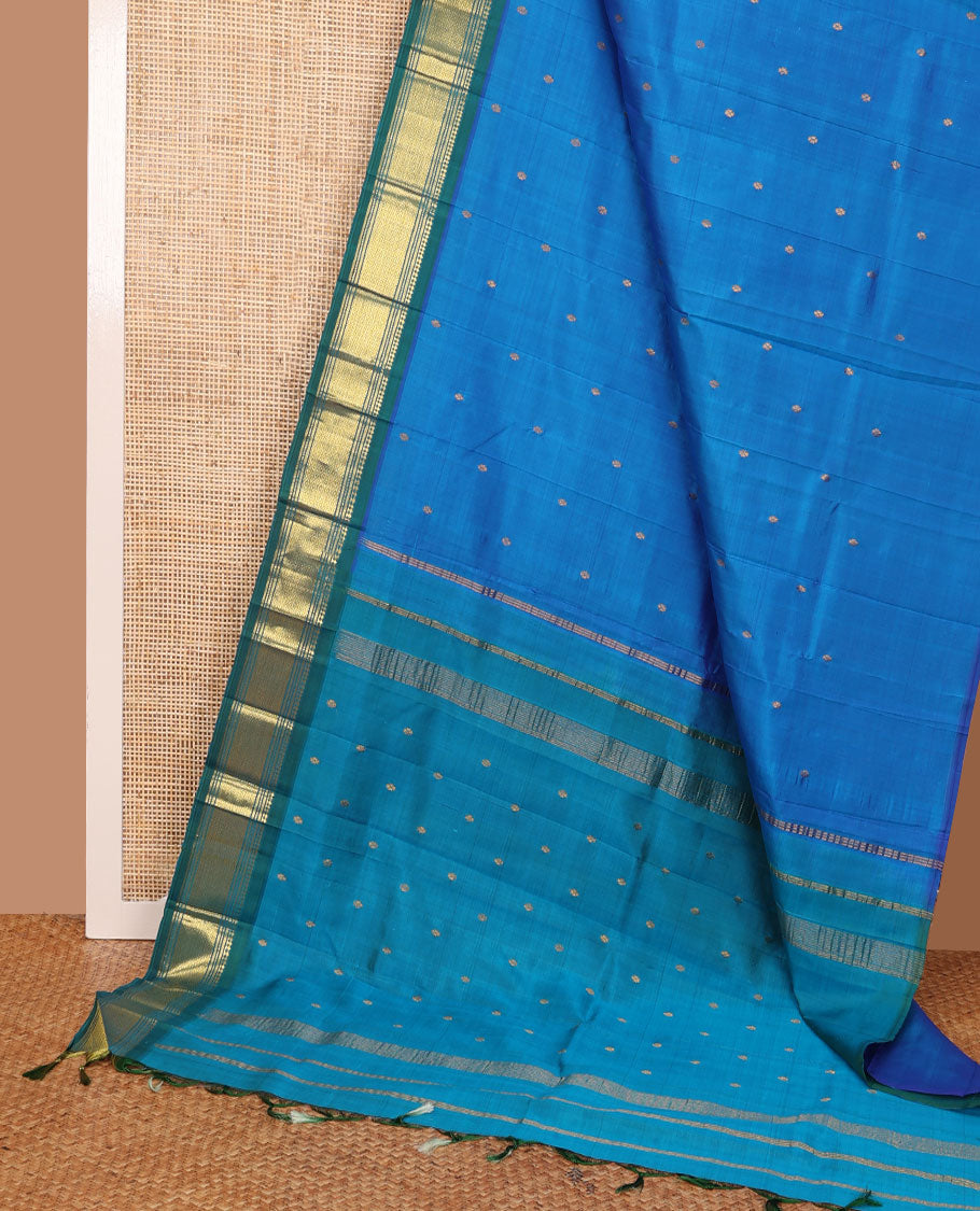 Blue Kanchipuram silk saree with zari buttas, contrast one-sided border of panner sombu,banaras,muthu & mayil kann & zari design pallu