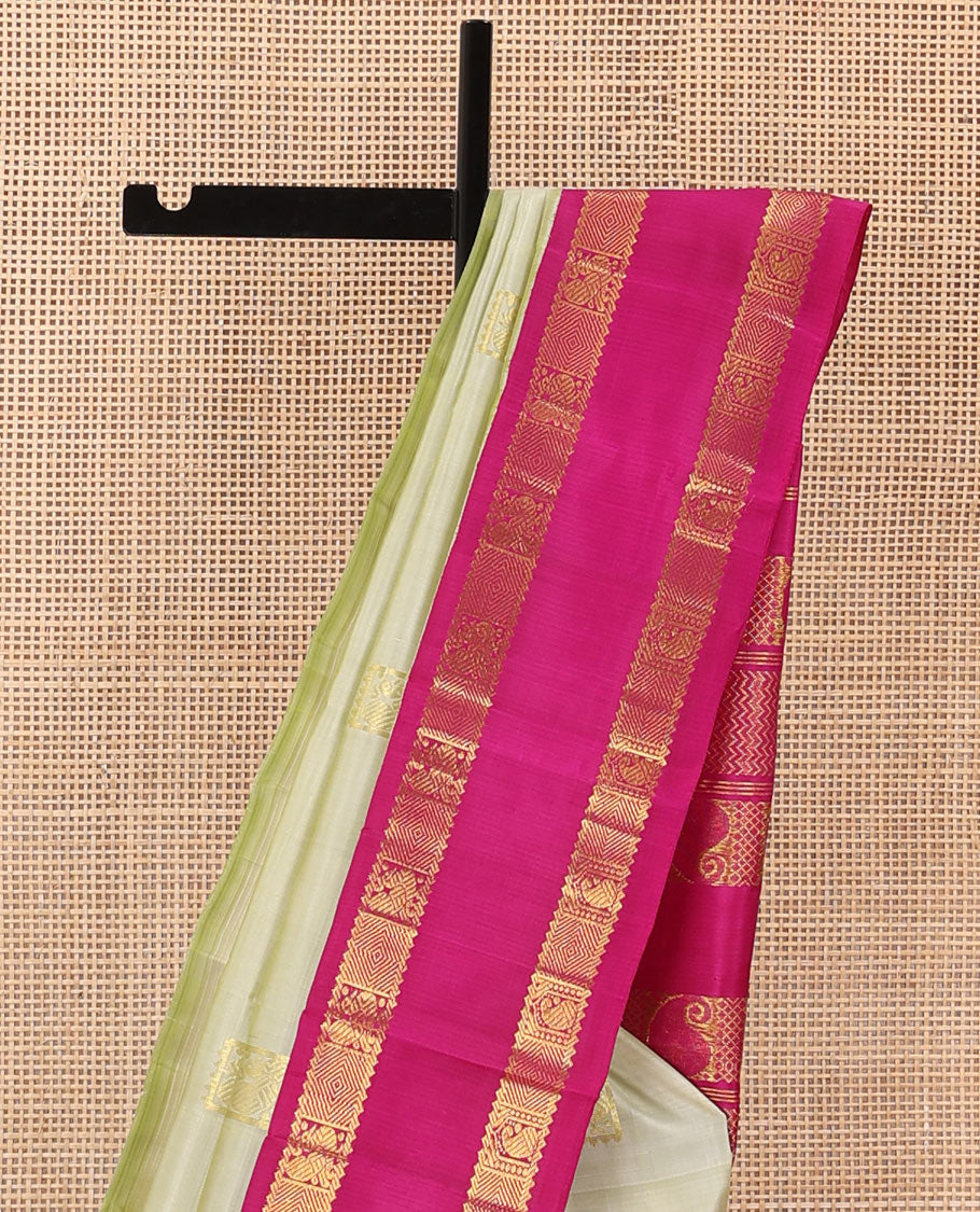 Pale green zari buttas Kanchipuram silk saree, contrast one-sided korvai rettai pettu border of rekku,mayil, manga, and diamond, and pallu of manga, and vanki