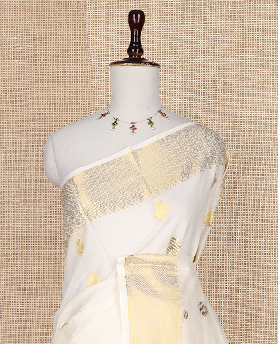 Cream club motifs zari woven Kerala saree, traditional zari border, and pallu steeped with clubs