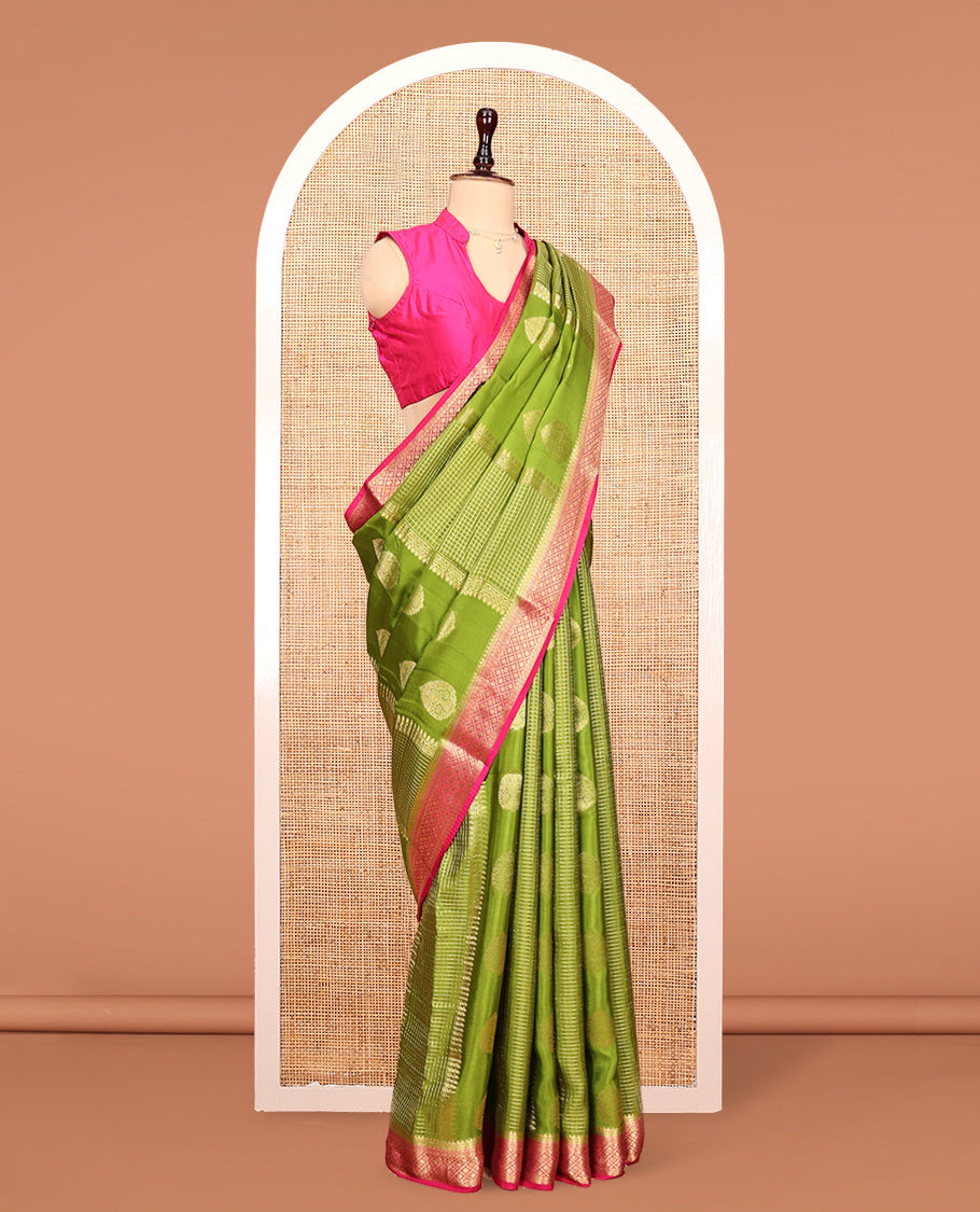 Green Mysore Silk Saree, Richly Detailed with Zari Buttas All Over Its Body, Complemented by a Contrast Traditional Zari Design Border, Pallu Steeped with Zari Stripes, and Paired with a Contrast Blouse