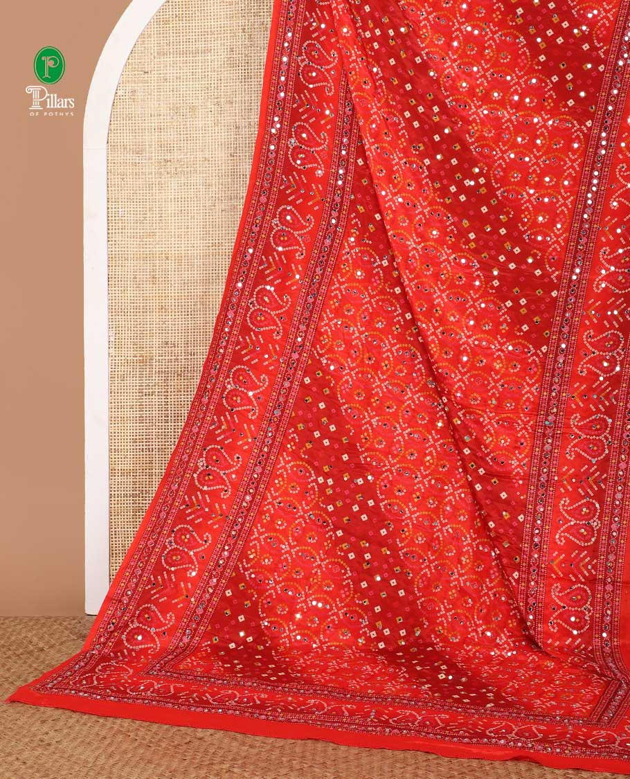 Red bhandani style printed, mirror work masakali saree with self mango bhandani printed, mirror work border 7 printed pallu along with printed blouse