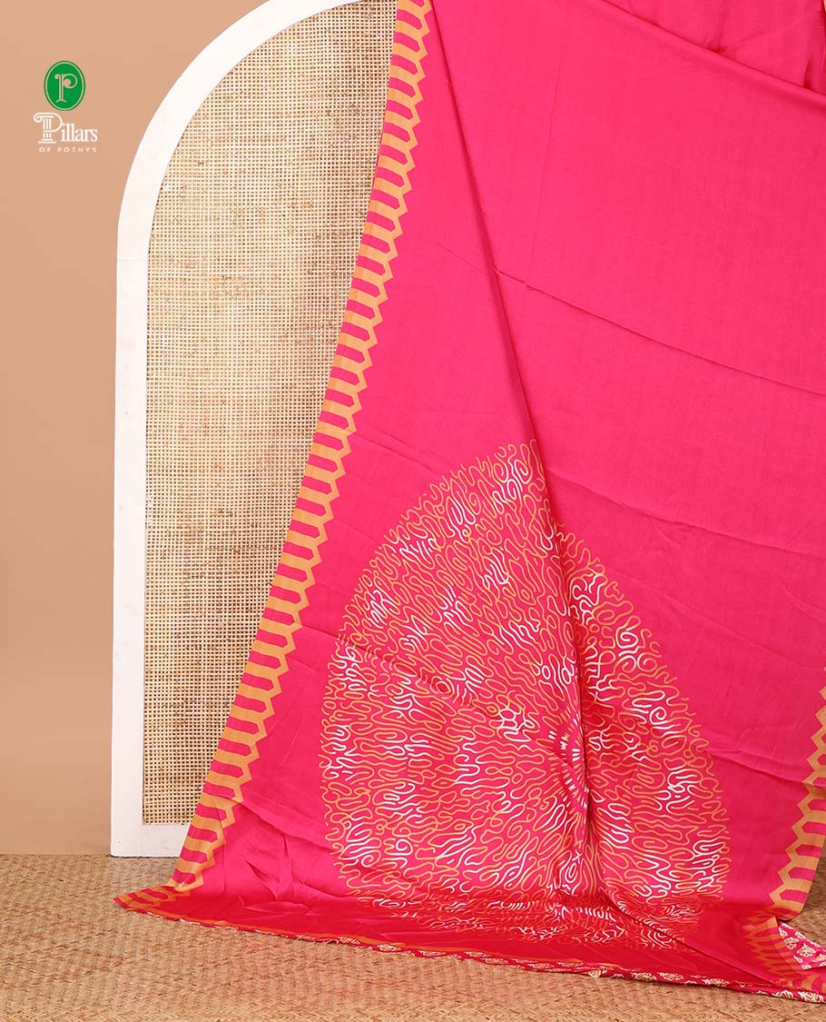Rani pink plain gajji silk saree features a temple-printed border, a circular-shaped vine-patterned pallu, and a unique motif-printed blouse