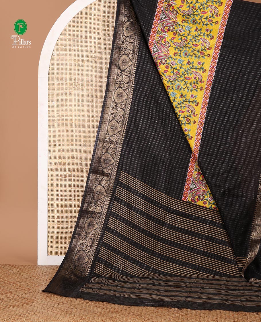 Black and gold dola silk saree with zari stripes and kalamkari-theme motifs printed on its center of the body, golden zari jacquard border & zari design blouse