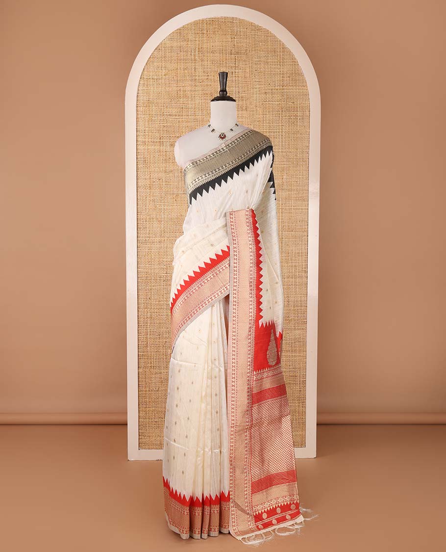 Half-white buttas banarasi jute saree, contrast traditional zari ganga-jamuna-style satin thread border, intricate pallu & plain blue blouse