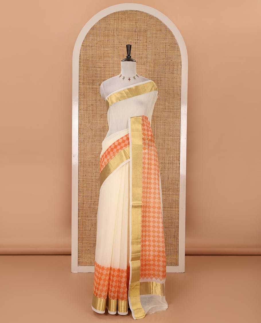 Cream with orange kerala cotton saree , diamond style printed with gold zari tissue bawanchi border & diamond design printed pallu with plain blouse