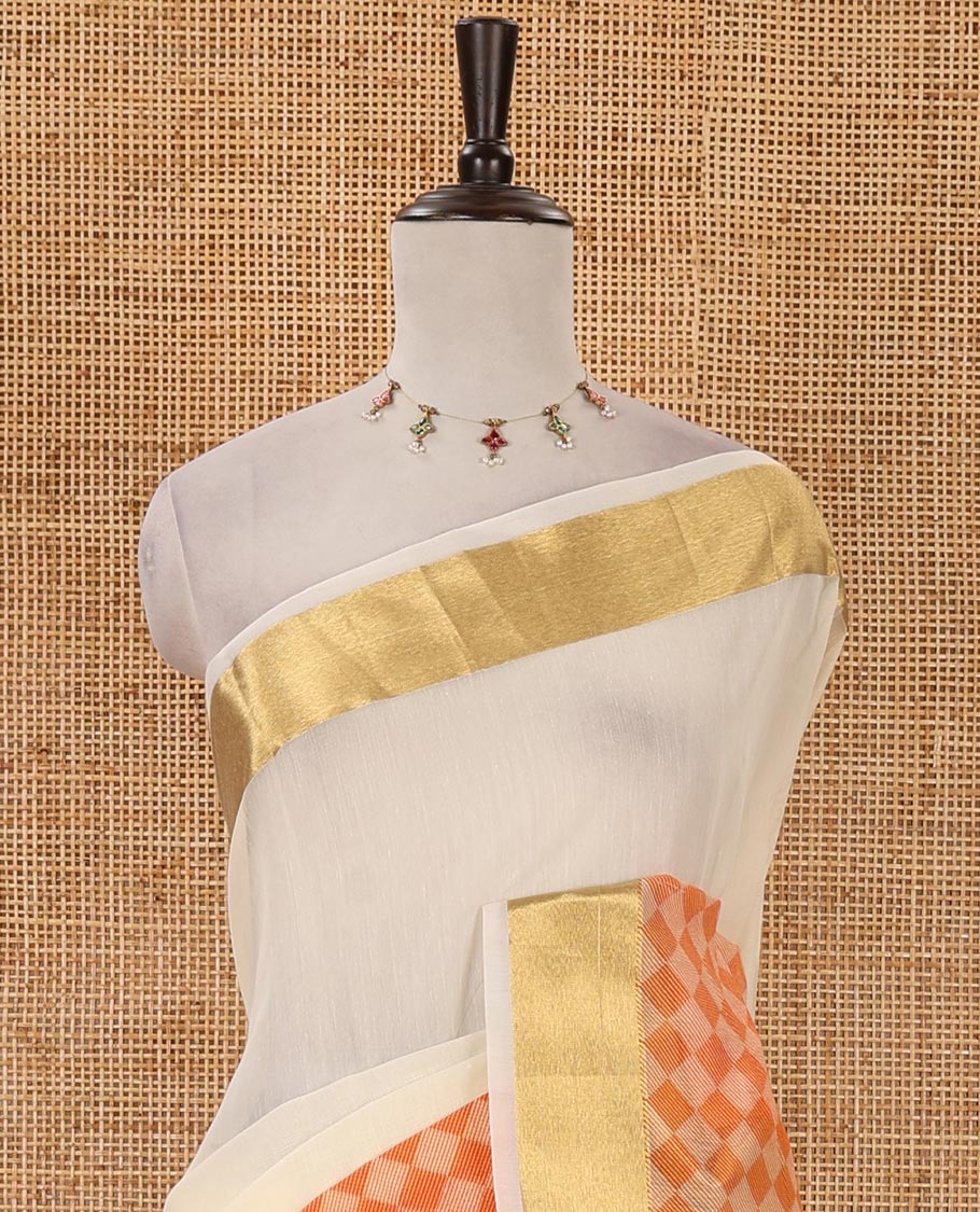 Cream with orange kerala cotton saree , diamond style printed with gold zari tissue bawanchi border & diamond design printed pallu with plain blouse