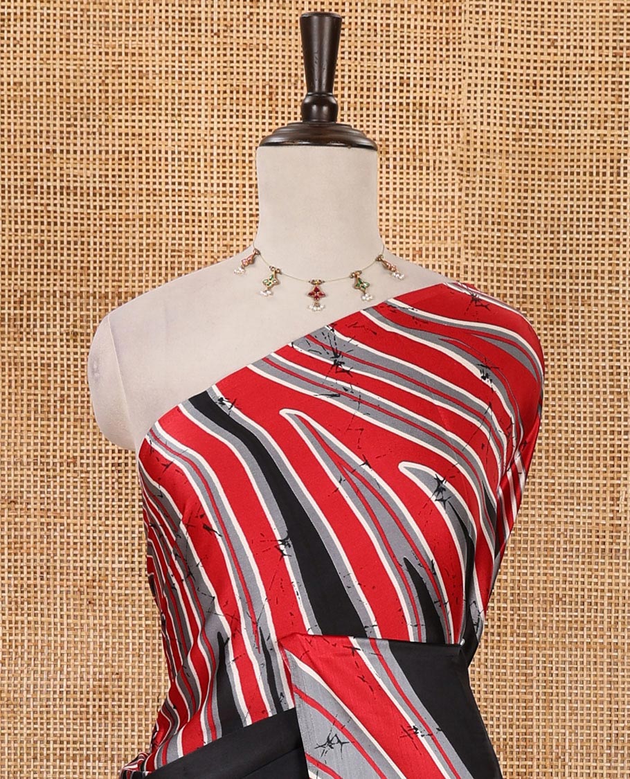Borderless black-red color batik-style abstract-printed satin crepe saree, contrast-printed blouse