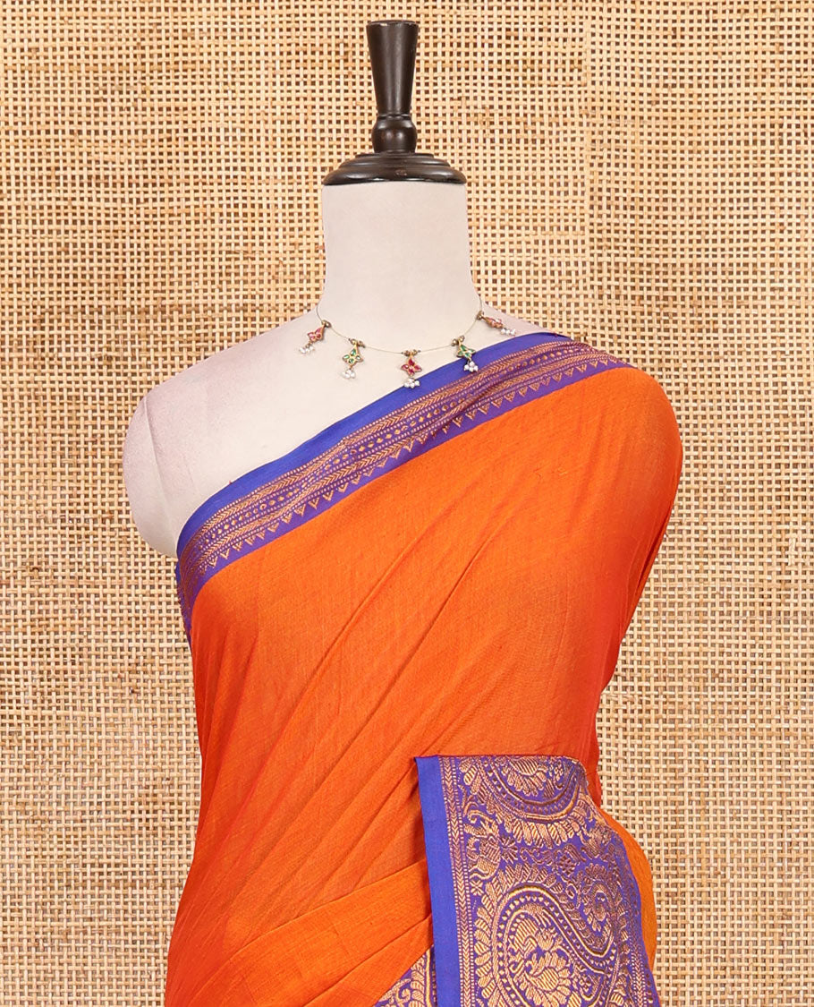 Orange plain design mercerised cotton saree, contrast traditional peacock enclosed manga border, striped pallu & matching blouse