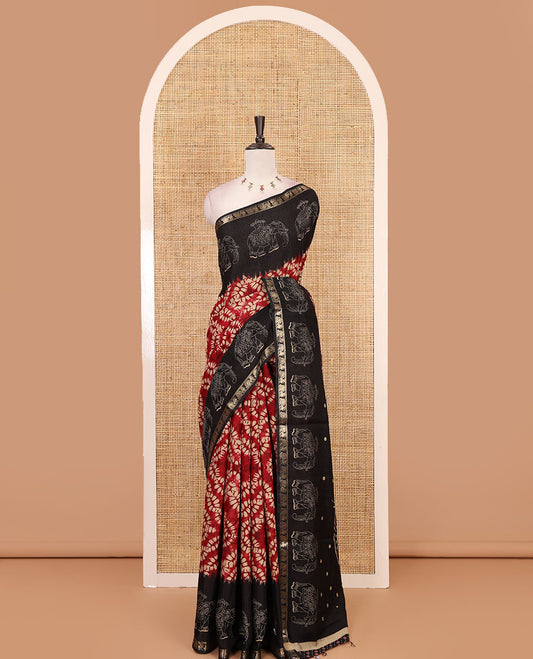 Maroon diamond patterns Shibori-style printed muslin cotton saree, contrast elephant motifs printed border, batik elephant motifs pallu & contrast flower buttas printed blouse