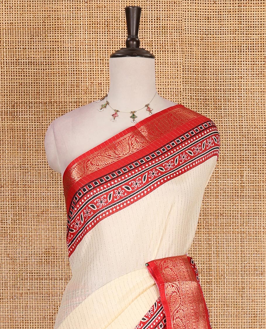 Cream-red zari striped dola silk saree, contrast traditional zari border of leaf creeper, Ajrakh printed pallu, and Ajrakh printed blouse