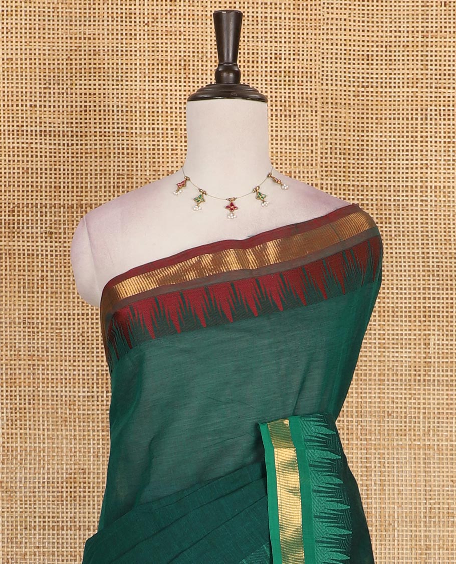 Green plain Chettinad cotton saree, contrast ganga jamuna temple zari border, striped pallu, and plain blouse