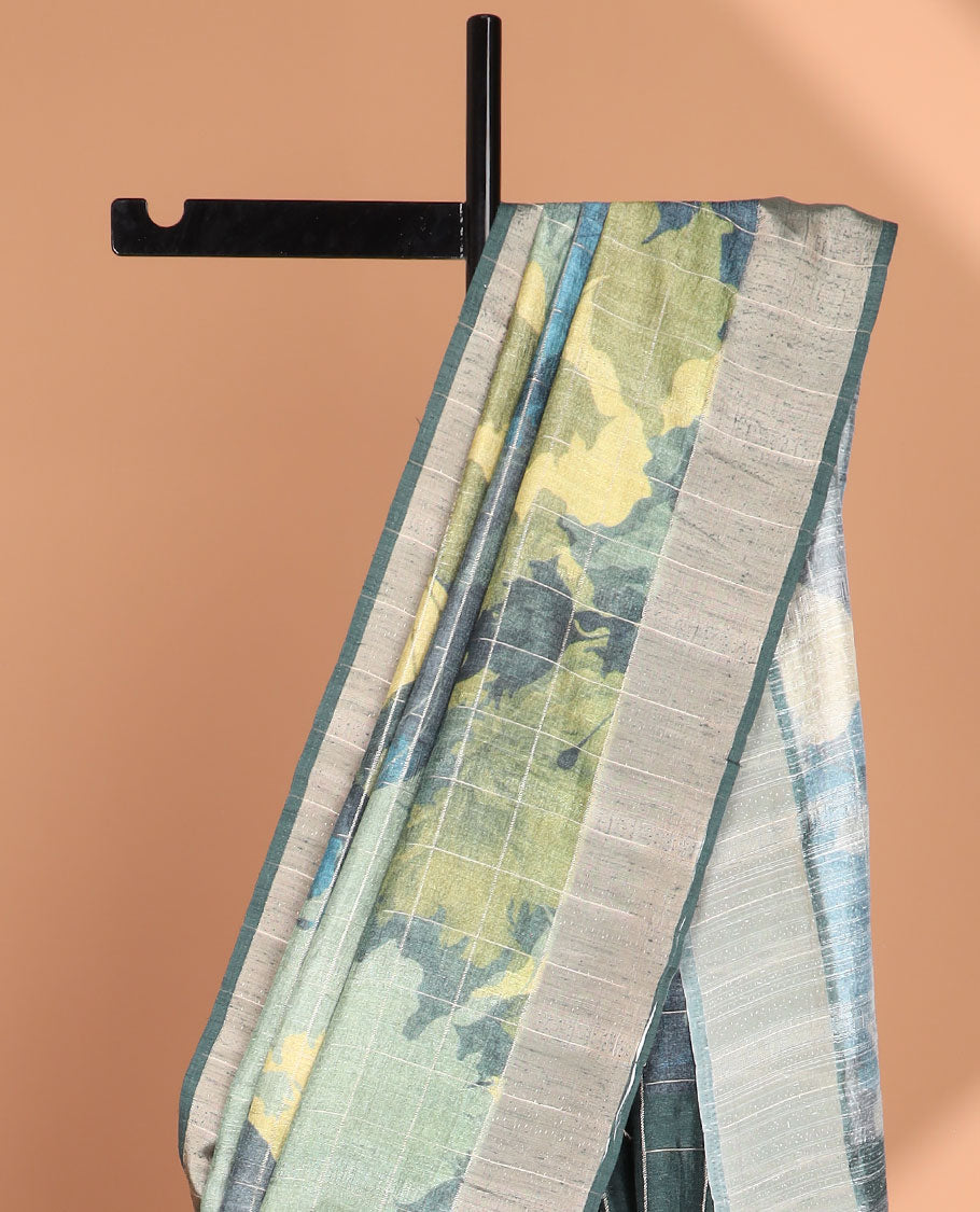Green checks with floral printe semi tussar saree, gold zari bawanchi border & printed pallu along with checked blouse