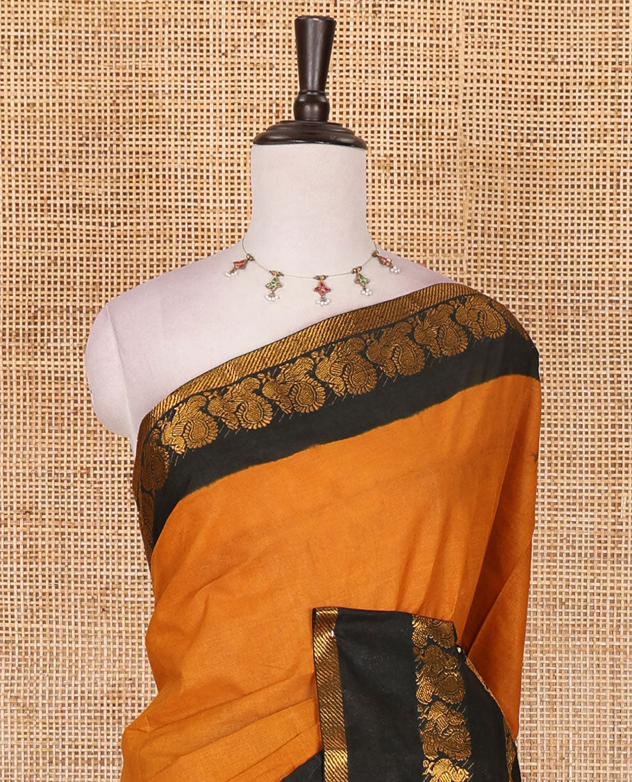 Mustard plain sungudi cotton saree, contrast annam motifs, gold zari woven border, zari striped, and zari design contrast blouse
