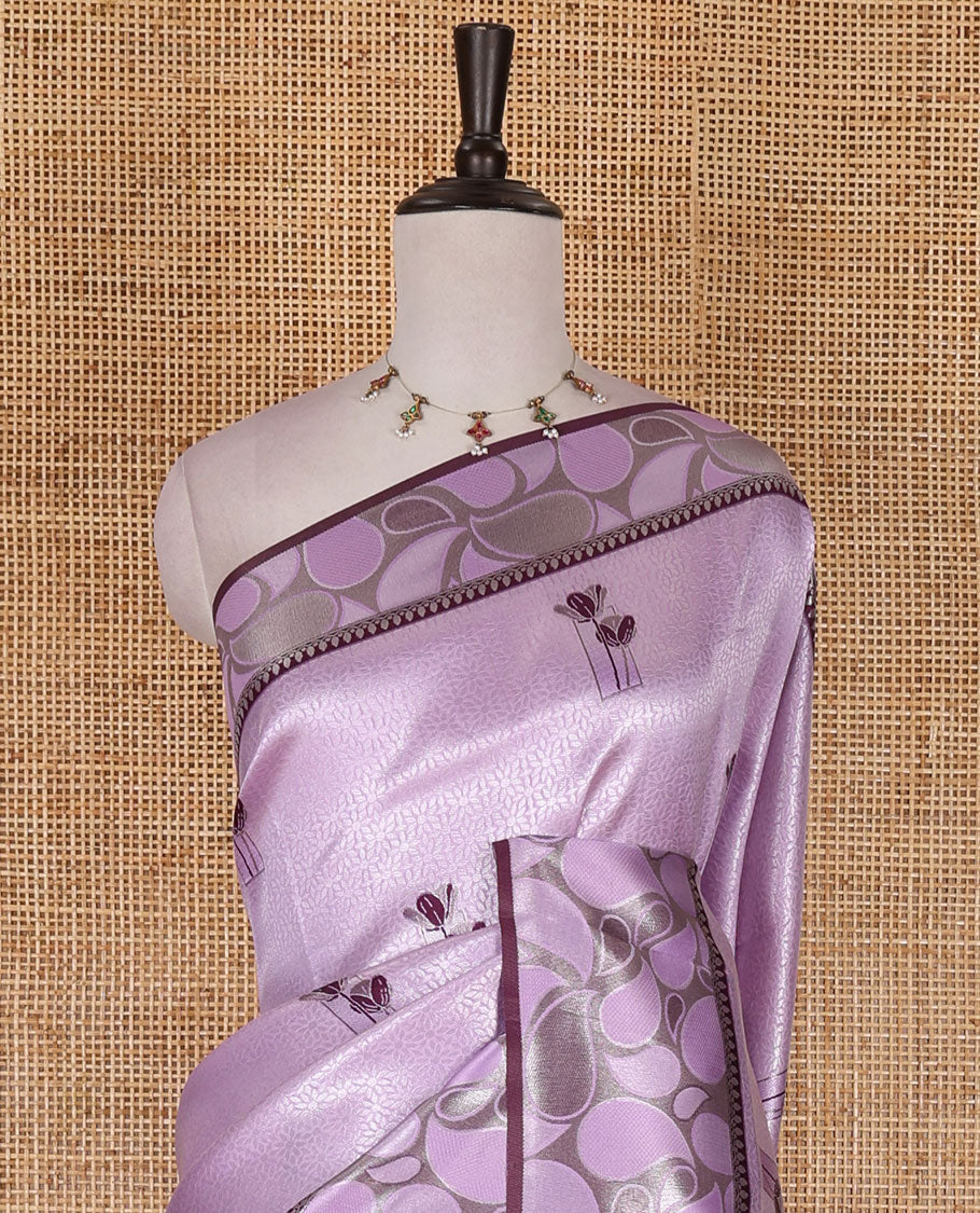 Purple jacquard kanchi silk saree, contrast border, and pallu steeped with paisley motifs with contrast zari design blouse