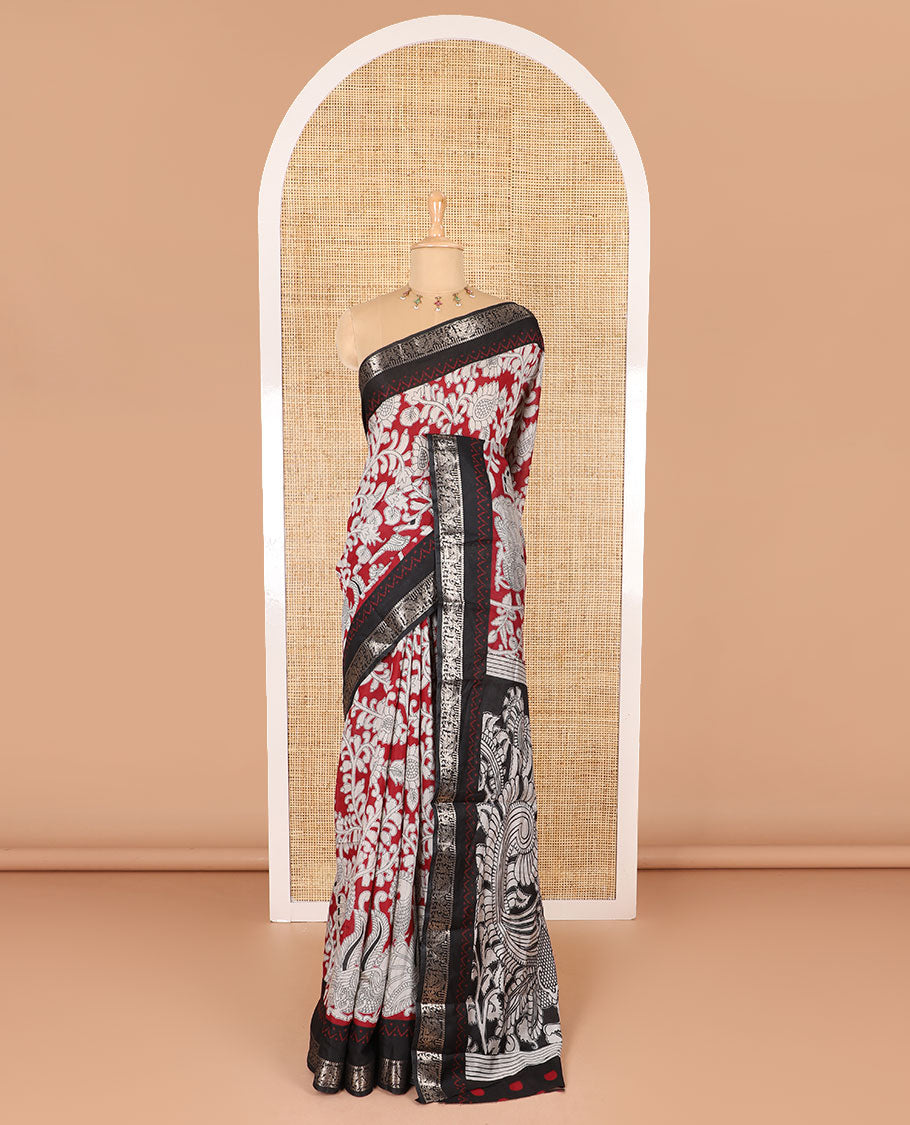 Maroon kalamkari floral vine and peacock printed muslin cotton saree, contrast zari border, kalamkari peacock printed pallu, and a contrast coin buttas printed blouse