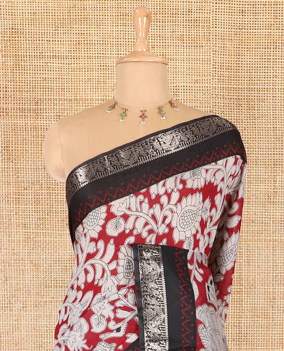 Maroon kalamkari floral vine and peacock printed muslin cotton saree, contrast zari border, kalamkari peacock printed pallu, and a contrast coin buttas printed blouse