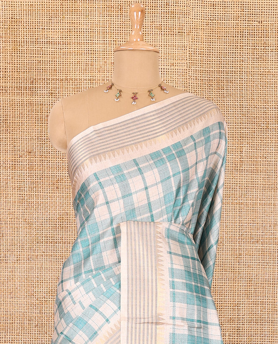 Rama checked patterned semi-tussar saree with contrast temple striped border, Madhubani printed pallu, and a contrast printed blouse