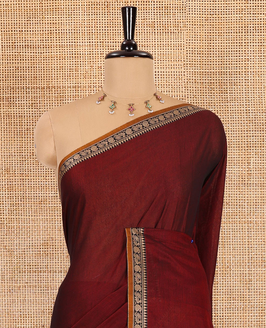 Maroon plain mercerised cotton saree, contrast temple traditional border, striped pallu, and a matching blouse
