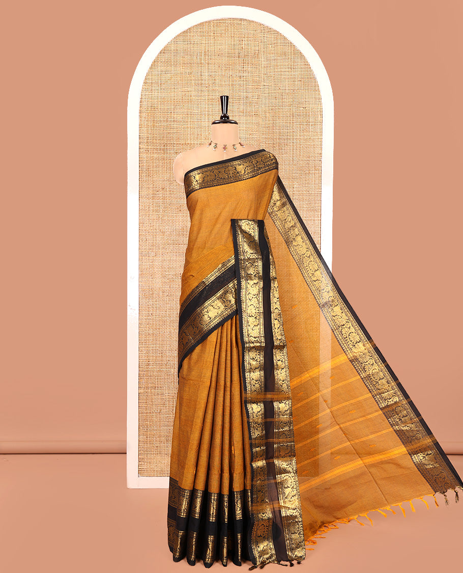 Mustard Chettinad Cotton Saree, Sparsely Woven with Buttas on Its Body, Complemented by a Contrast Rettai Pettu Border of Temple, Peacock, and Floral Creeper Designs, Pallu of Stripes and Buttas, and Paired with a Matching Blouse