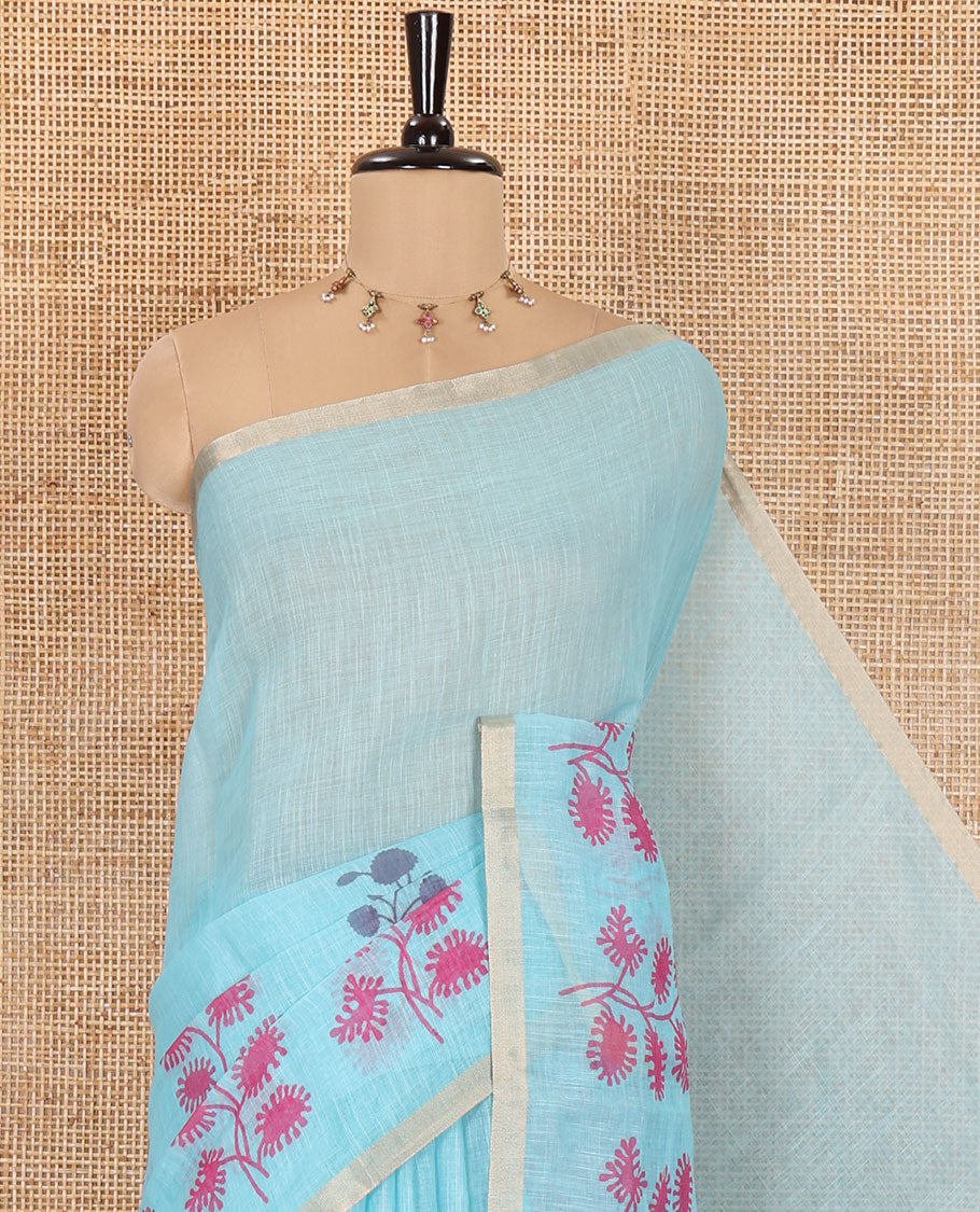 Blue Linen Saree, Adorned with Floral Motifs Printed on Its Body, a Subtle Piping Border, Pallu Steeped with Floral Motifs and Stripes, and Paired with a Contrast Blouse