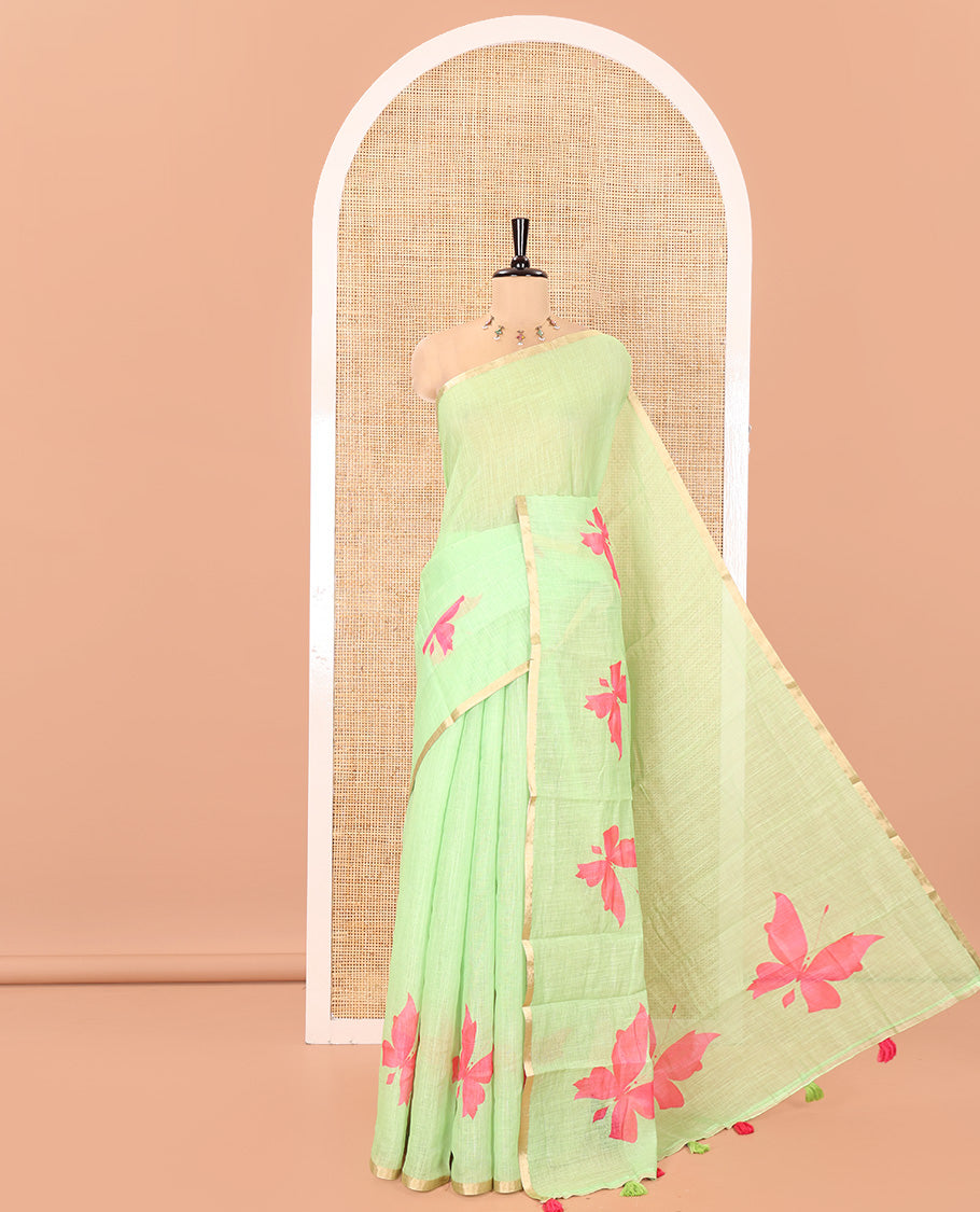 Green Linen Cotton Saree, Adorned with Butterfly Buttas All Over Its Body, Subtle Piping Border, Pallu of Butterfly Print, and Paired with a Contrast Fairy Motifs Printed Blouse