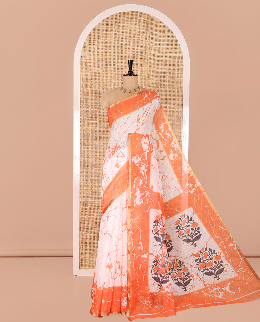 Cream and Orange Linen Cotton Saree, Adorned with Batik Print on Its Body, Complemented by Contrast Batik Printed Border, Pallu of Floral Print, and Paired with a Contrast Blouse