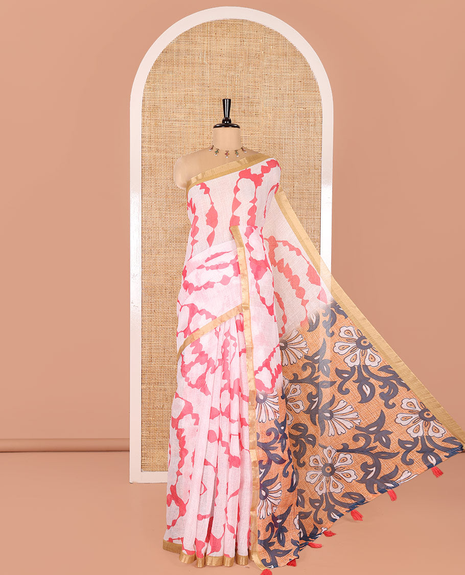 White Linen Cotton Saree, Adorned with Shibori Print On Its Body, Subtle Piping Border, Pallu Steeped with Floral Vine Print, and Paired with a Printed Blouse