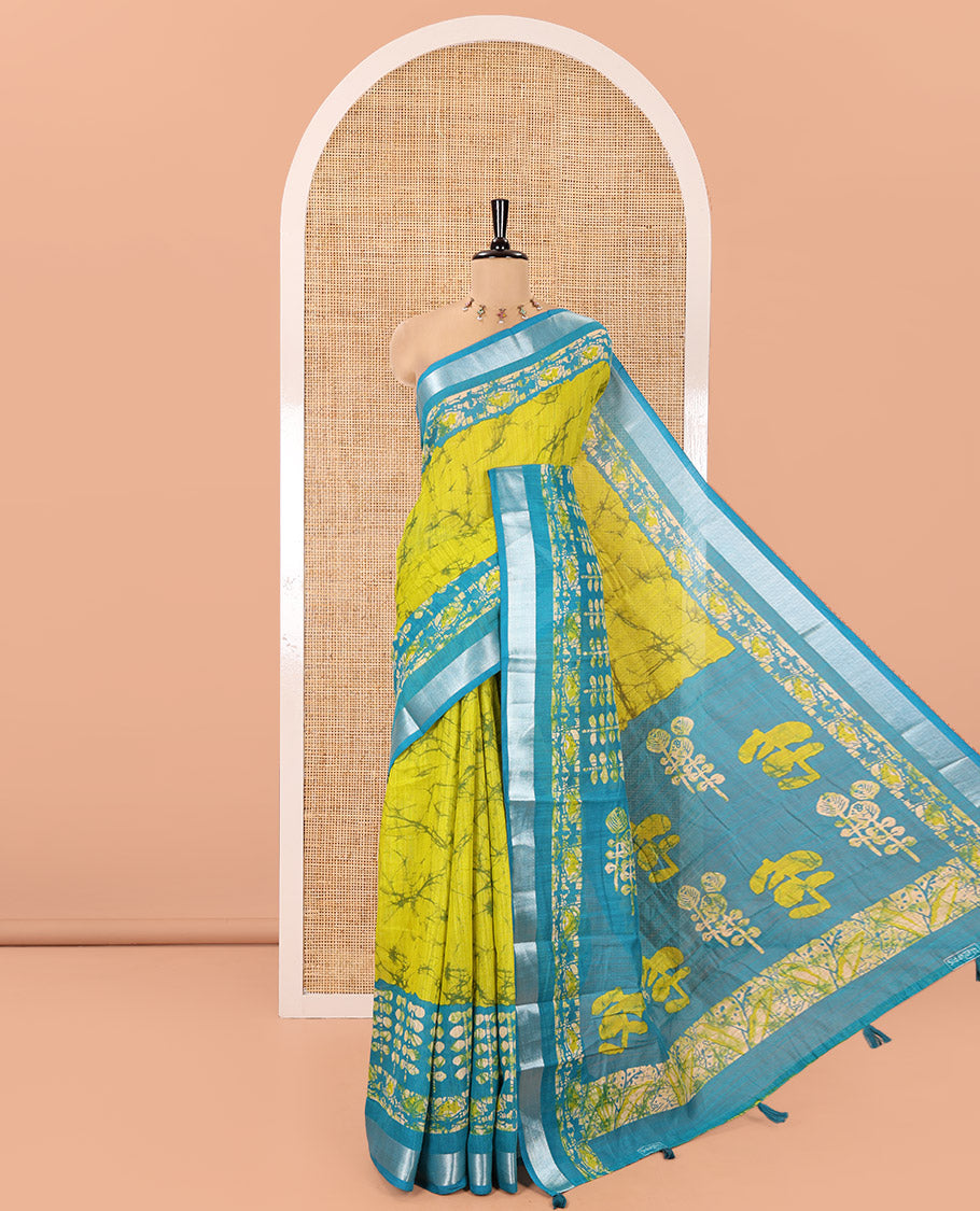 Lemen Yellow Linen Cotton Saree, Adorned with Shibori Printed All Over Its Body, Complemented by a Contrast Batik Printed Zari Border, Floral Printed Pallu, and Paired with a Contrast Blouse