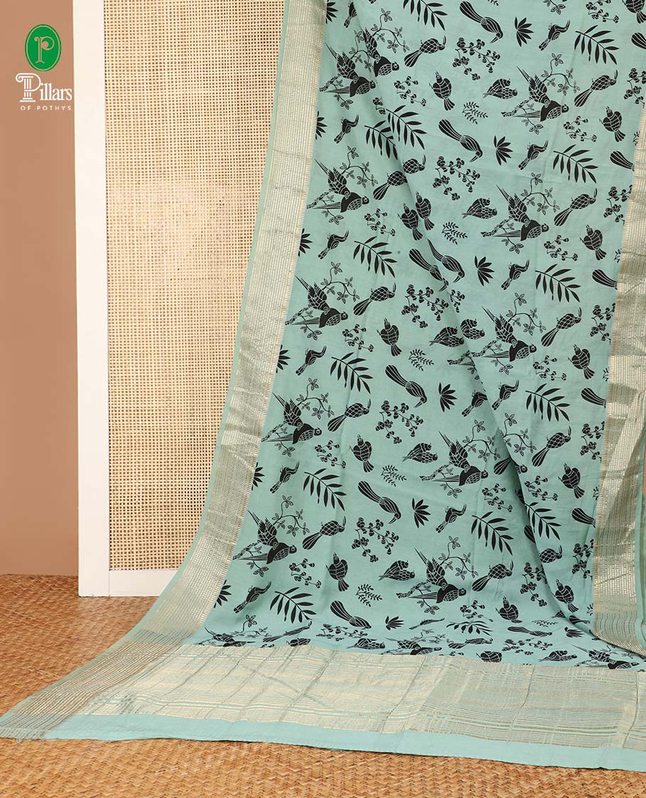 Pista green birds printed assam silk saree with zari striped border & chit pallu along with butta printed blouse