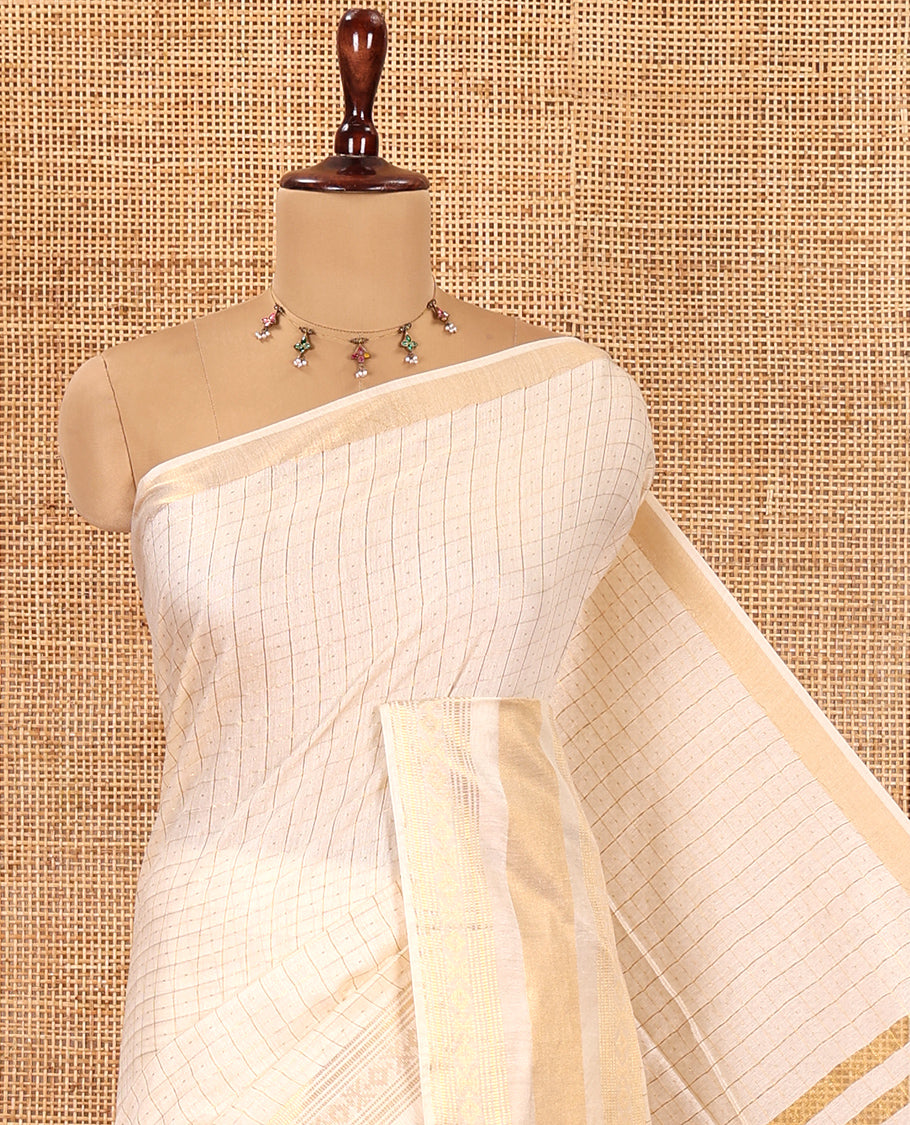 Cream Bhagalpuri Cotton Saree, Adorned with Butta Enclosed Checks, a Traditional Zari Border, and a Matching Blouse