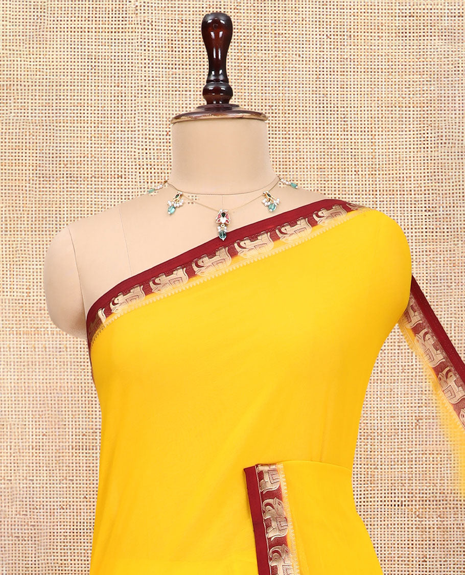 Yellow Plain Fancy Chiffon Saree, a Contrast Elephant Zari Border, Zari Striped Pallu, and a Contrast Blouse
