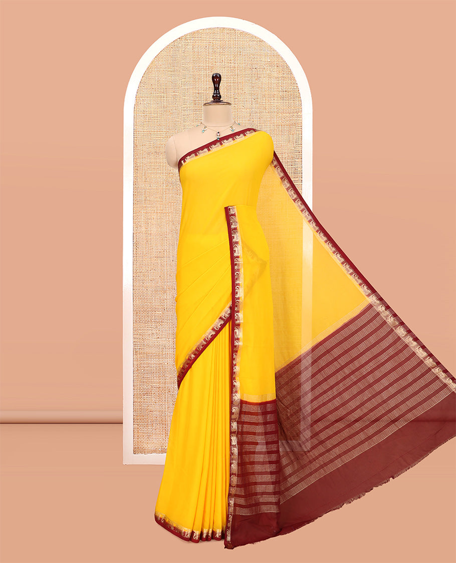 Yellow Plain Fancy Chiffon Saree, a Contrast Elephant Zari Border, Zari Striped Pallu, and a Contrast Blouse