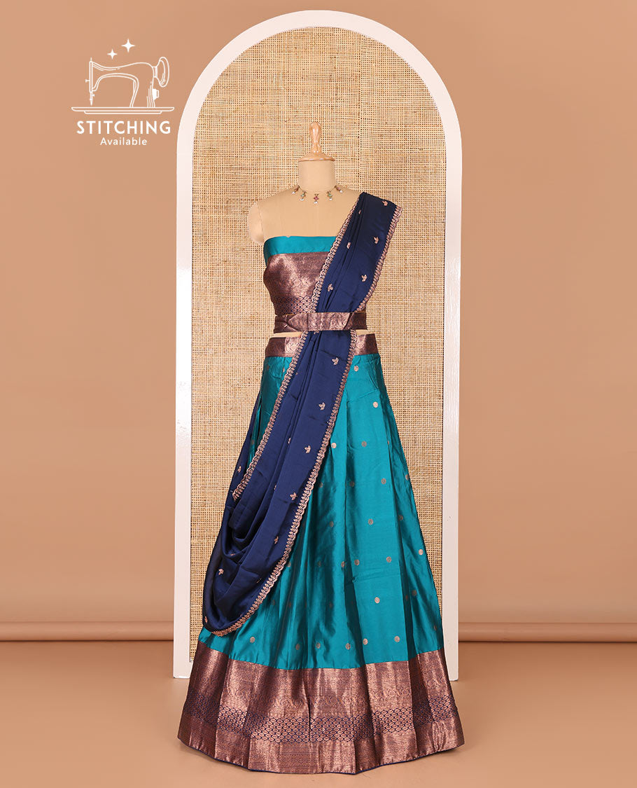 Rama green taffeta silk half-saree, flower zari buttas and contrast traditional zari bordered skirt, a matching blouse, and contrast embroidered satin georgette scallop dhavani