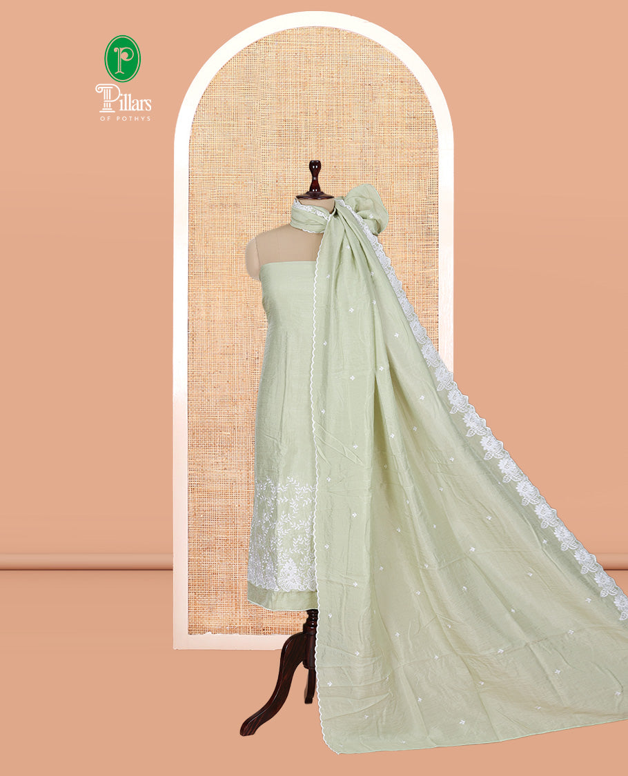Pista Green Mul Chanderi Material Churidar with Delicate Floral Embroidered Top, a Plain Bottom, and Scallop Embroidered Dupatta