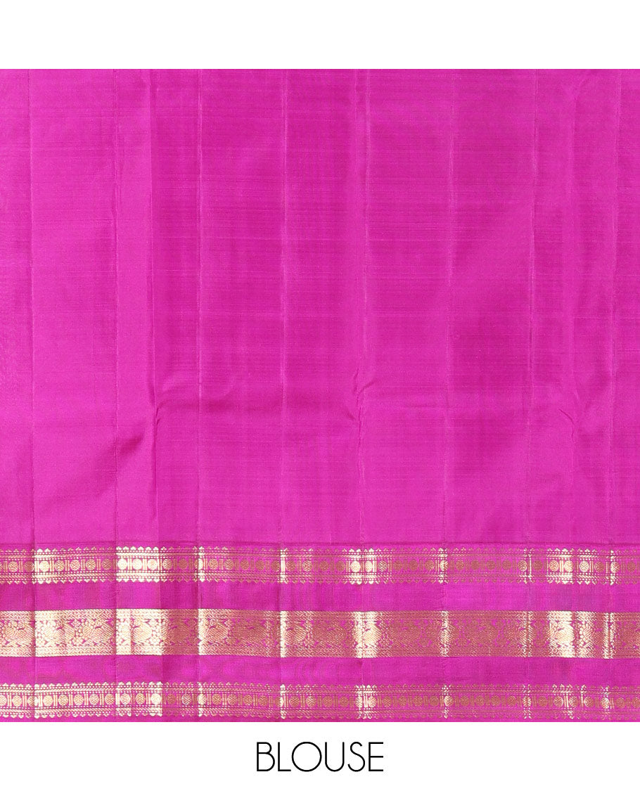 Parrot Green Vasundhara Silk Saree Richly Detailed with Zari Buttas, Complemented with Varisai Pettu Border Featuring Rekku, Muthu, Banaras, Rudraksham, and Mayil Designs, Majestically Zari Woven Pallu, and a Contrast Blouse