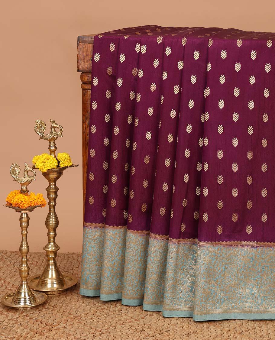 Wine color geometrical butta dola raw silk with contrast kalakshetra zari border & diamond rich pallu along with plain, peacock butta blouse