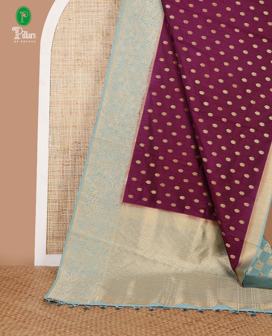 Wine color geometrical butta dola raw silk with contrast kalakshetra zari border & diamond rich pallu along with plain, peacock butta blouse