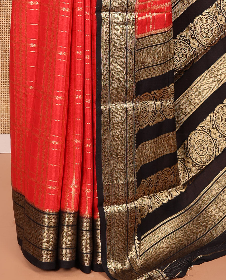 Red and Black Semi-Mysore Silk Saree Enriched with Intricate Zari Checks on Its Body, Complemented by a Contrast Geometric Patterns Zari Woven Border, Pallu Spotlighted with Chakram Motifs, and Paired with a Contrast Blouse